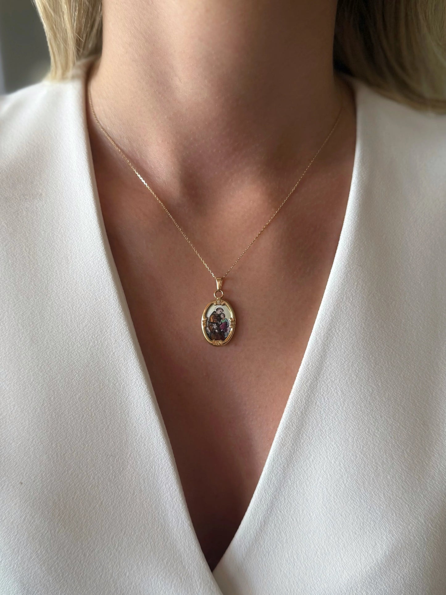 Gold necklace with the image of St. Anthony
